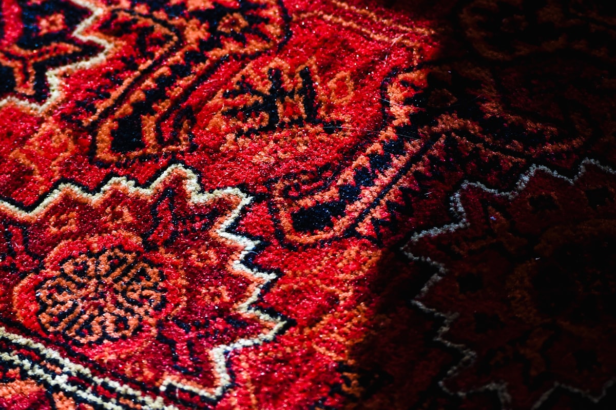 Traditional red patterned carpet with intricate designs